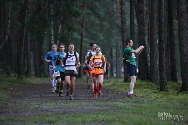 Skrējēji un tūrists